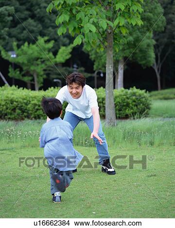 A boy running up to his father View Large Photo Image Picture - A boy running up to his father. Fotosearch