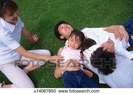 Stock Image - Family at a park. Fotosearch
