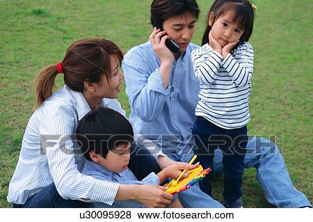 Stock Photo - Family at a park. Fotosearch