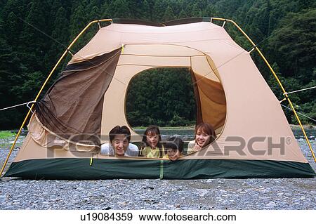 Family lying on front in a tent View Large Photo Image Stock Photo - Family lying on front in a tent. Fotosearch