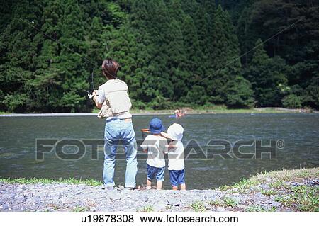 Father and children catching fishes View Large Photo Image Stock Photo - Father and children catching fishes. Fotosearch