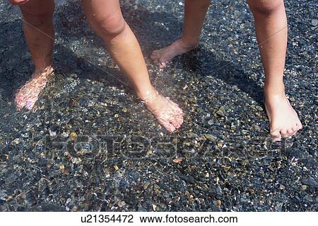 Legs of children standing at riverside View Large Photo Image Stock Image - Legs of children standing at riverside. Fotosearch