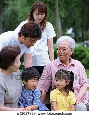 Stock Photo - Portrait of three generational family. Fotosearch