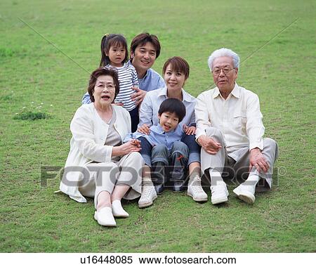 Stock Photography - Portrait of three generational family. Fotosearch