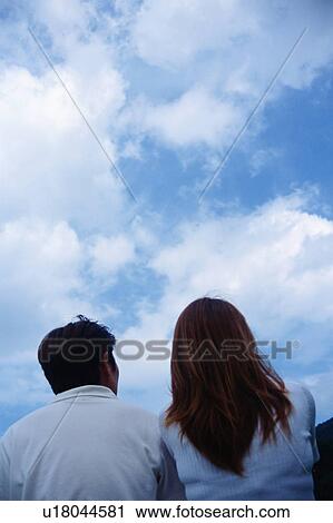 Rear view of mid adult couple View Large Photo Image Stock Image - Rear view of mid adult couple. Fotosearch
