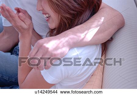 Picture - Young couple embracing. Fotosearch