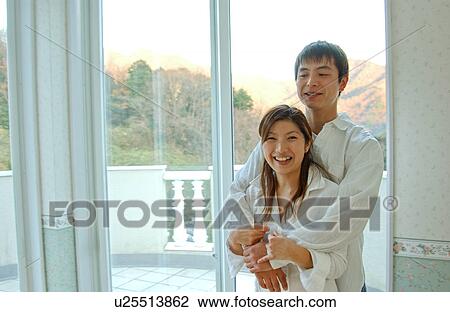 Young couple embracing View Large Photo Image Stock Image - Young couple embracing. Fotosearch