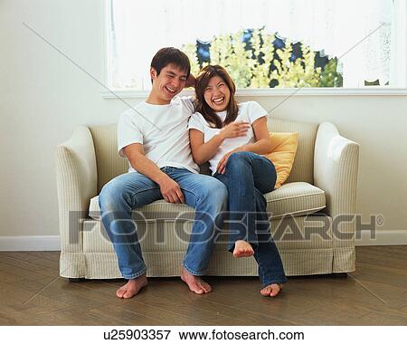 Young couple laughing View Large Photo Image Stock Photo - Young couple laughing. Fotosearch