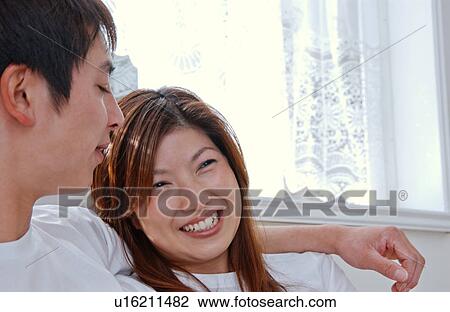 Young couple talking View Large Photo Image Stock Image - Young couple talking. Fotosearch
