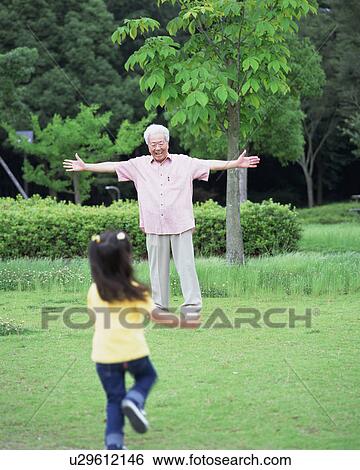 A girl running toward a grand father View Large Photo Image Stock Photograph - A girl running toward a grand father. Fotosearch