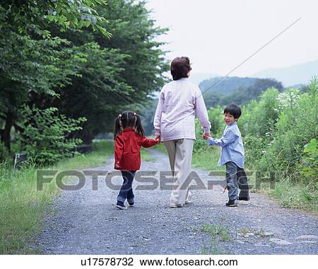 A grand mother walking with grand children View Large Photo Image Stock Image - A grand mother walking with grand children. Fotosearch