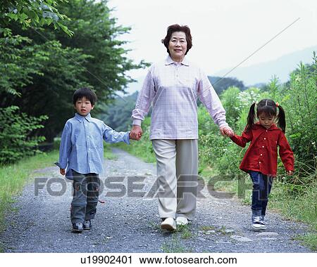 A grand mother walking with grand children View Large Photo Image Stock Image - A grand mother walking with grand children. Fotosearch