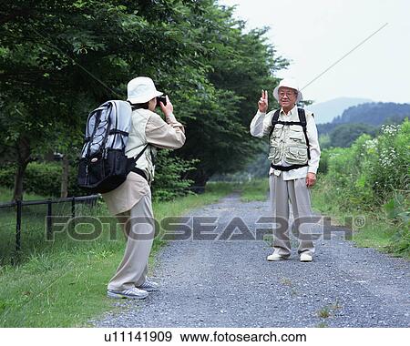 A senior couple taking a picture View Large Photo Image Stock Photo - A senior couple taking a picture. Fotosearch