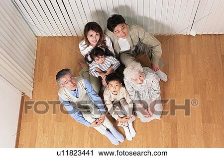 Stock Image - Portrait of three generational family. Fotosearch