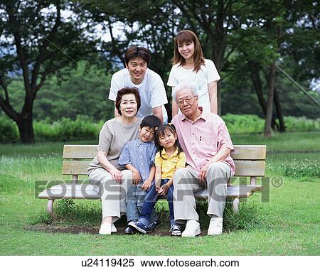 Stock Photography - Portrait of three generational family. Fotosearch