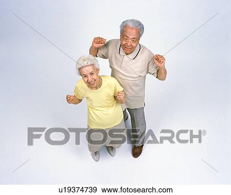 A senior couple standing View Large Photo Image Stock Photo - A senior couple standing. Fotosearch