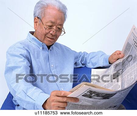 A senior man reading newspaper View Large Photo Image Stock Image - A senior man reading newspaper. Fotosearch