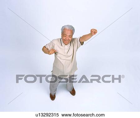 Stock Photography - A senior man stretching arm. Fotosearch