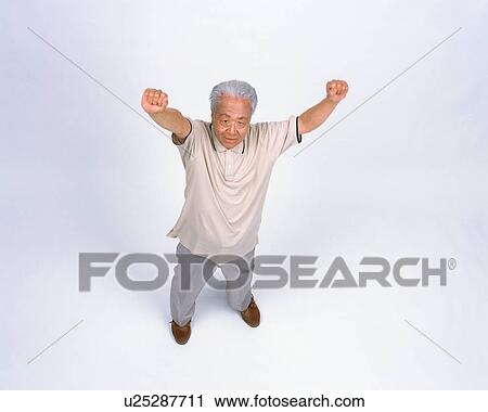 Stock Image - A senior man stretching arms. Fotosearch