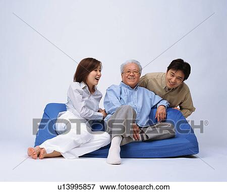 A senior man talking with his children View Large Photo Image Stock Photo - A senior man talking with his children. Fotosearch
