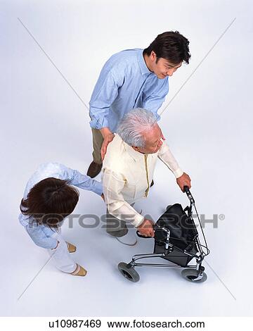 Stock Photo - A senior man with walker. Fotosearch
