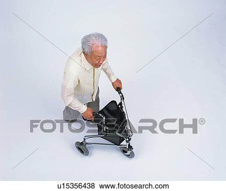 A senior man with walker View Large Photo Image Stock Photo - A senior man with walker. Fotosearch