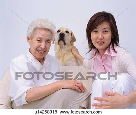 Stock Photo - A senior woman and her granddaughter. Fotosearch