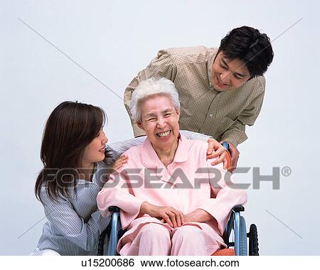 A senior woman in a wheel chair talking with her grand children View Large Photo Image Stock Photograph - A senior woman in a wheel chair talking with her grand children. Fotosearch