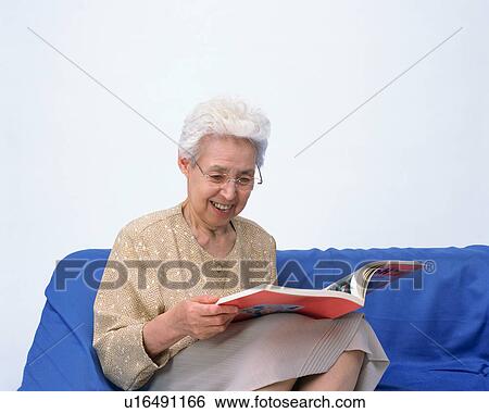 A senior woman reading a book View Large Photo Image Stock Photograph - A senior woman reading a book. Fotosearch