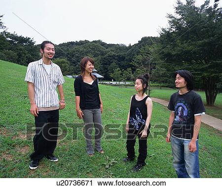 Four young people standing in fields View Large Photo Image Stock Image - Four young people standing in fields. Fotosearch