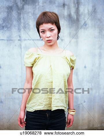 Portrait of a young woman View Large Photo Image Stock Photo - Portrait of a young woman. Fotosearch