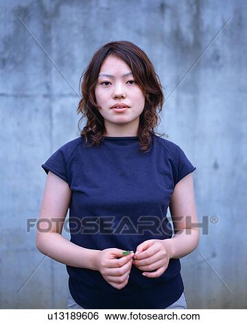 Stock Photograph - Portrait of a young woman. Fotosearch