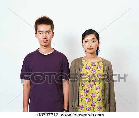 Stock Image - Portrait of two young people. Fotosearch