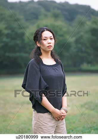 Stock Photo - Portrait of a young woman. Fotosearch