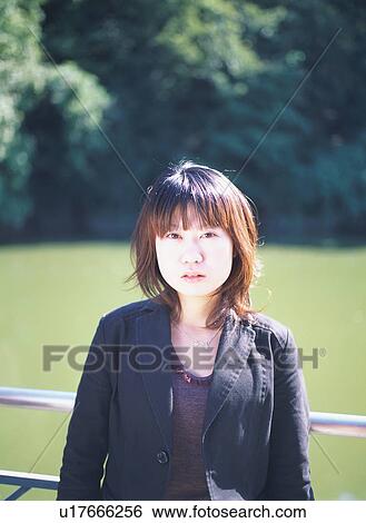 Stock Photograph - Portrait of a young woman. Fotosearch