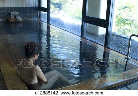 A young woman bathing in hot springs View Large Photo Image Stock Image - A young woman bathing in hot springs. Fotosearch