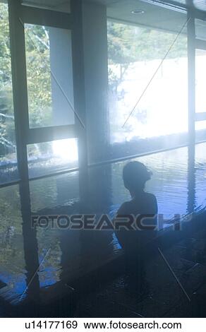 A young woman bathing in hot springs View Large Photo Image Stock Photo - A young woman bathing in hot springs. Fotosearch