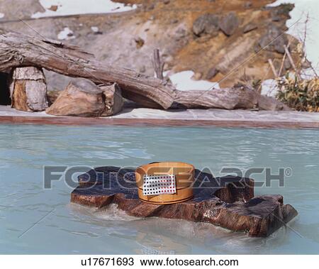 Stock Image - Bathing pail at hot springs in Japan. Fotosearch