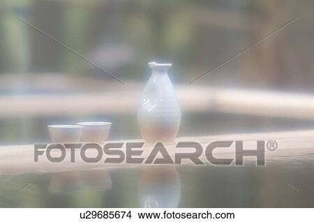 Picture - Sake bottle and cups. Fotosearch