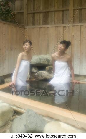Two young women bathing in hot springs View Large Photo Image Stock Image - Two young women bathing in hot springs. Fotosearch