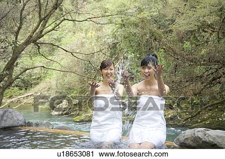 Two young women bathing in hot springs View Large Photo Image Stock Image - Two young women bathing in hot springs. Fotosearch