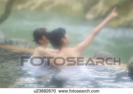 Two young women bathing in hot springs View Large Photo Image Stock Image - Two young women bathing in hot springs. Fotosearch