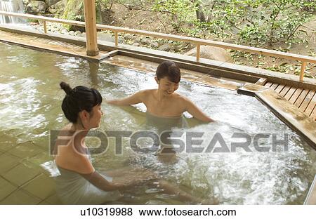 Two young women bathing in hot springs View Large Photo Image Stock Photo - Two young women bathing in hot springs. Fotosearch