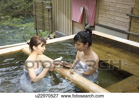 Two young women bathing in hot springs View Large Photo Image Stock Photo - Two young women bathing in hot springs. Fotosearch