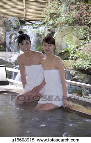 Two Young Women Bathing In Hot Springs Stock Photography U Fotosearch