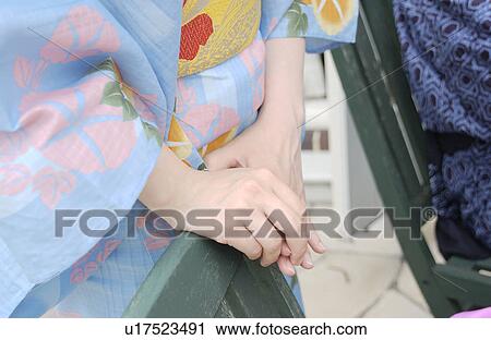 A woman in kimono standing View Large Photo Image Stock Image - A woman in kimono standing. Fotosearch