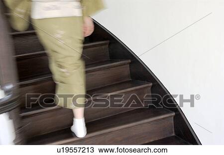 A woman in kimono walking up stairs, blurred motion View Large Photo Image Stock Image - A woman in kimono walking up stairs, blurred motion. Fotosearch