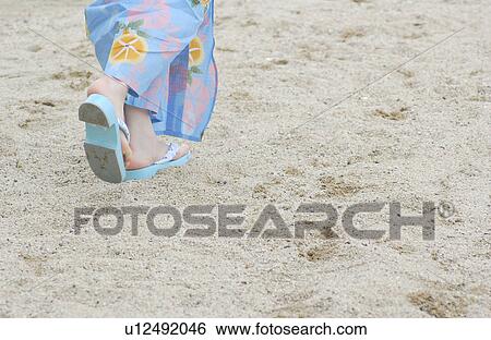 Stock Photograph - Low section of a young woman in kimono. Fotosearch