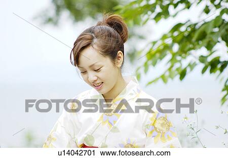 Portrait of a young woman in kimono View Large Photo Image Stock Image - Portrait of a young woman in kimono. Fotosearch