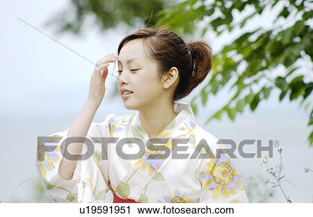 Portrait of a young woman in kimono View Large Photo Image Stock Image - Portrait of a young woman in kimono. Fotosearch